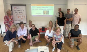 Ligatus Group TeamSing EVENT workshop with 170 international employees at the Komed in Cologne, conducted by Adrienne Morgan Hammond.
